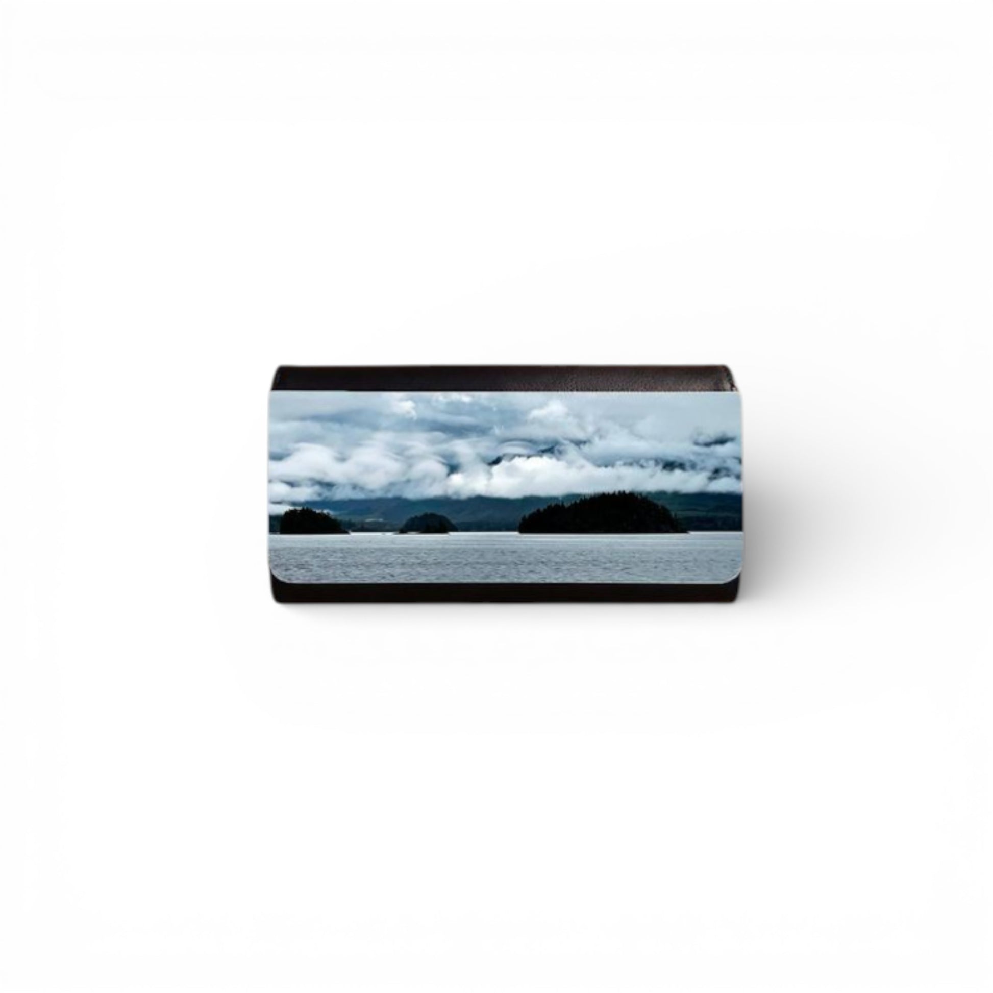 Rectangular object with a scenic design of mountains and clouds on a white background