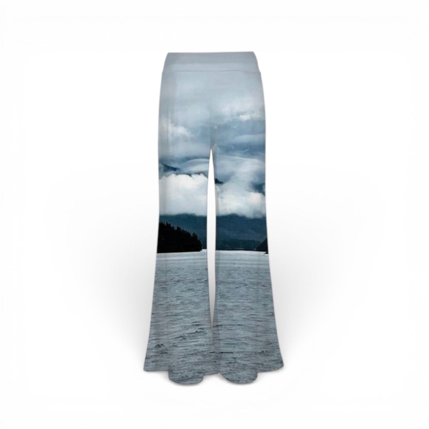 Flared pants with a scenic print of a lake and trees on a white background