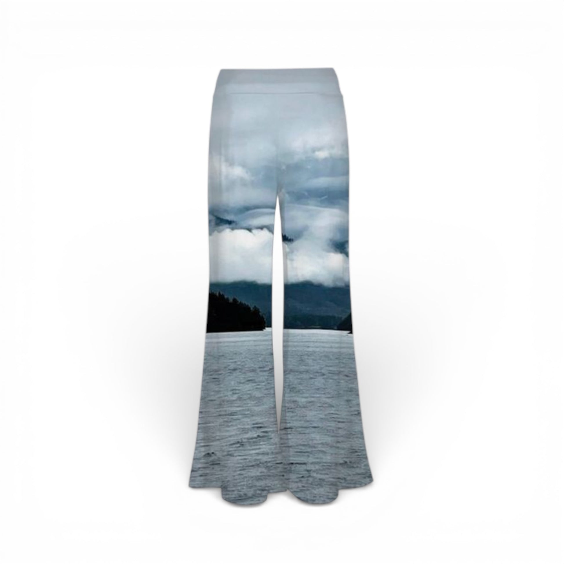 Flared pants with a scenic print of a lake and trees on a white background