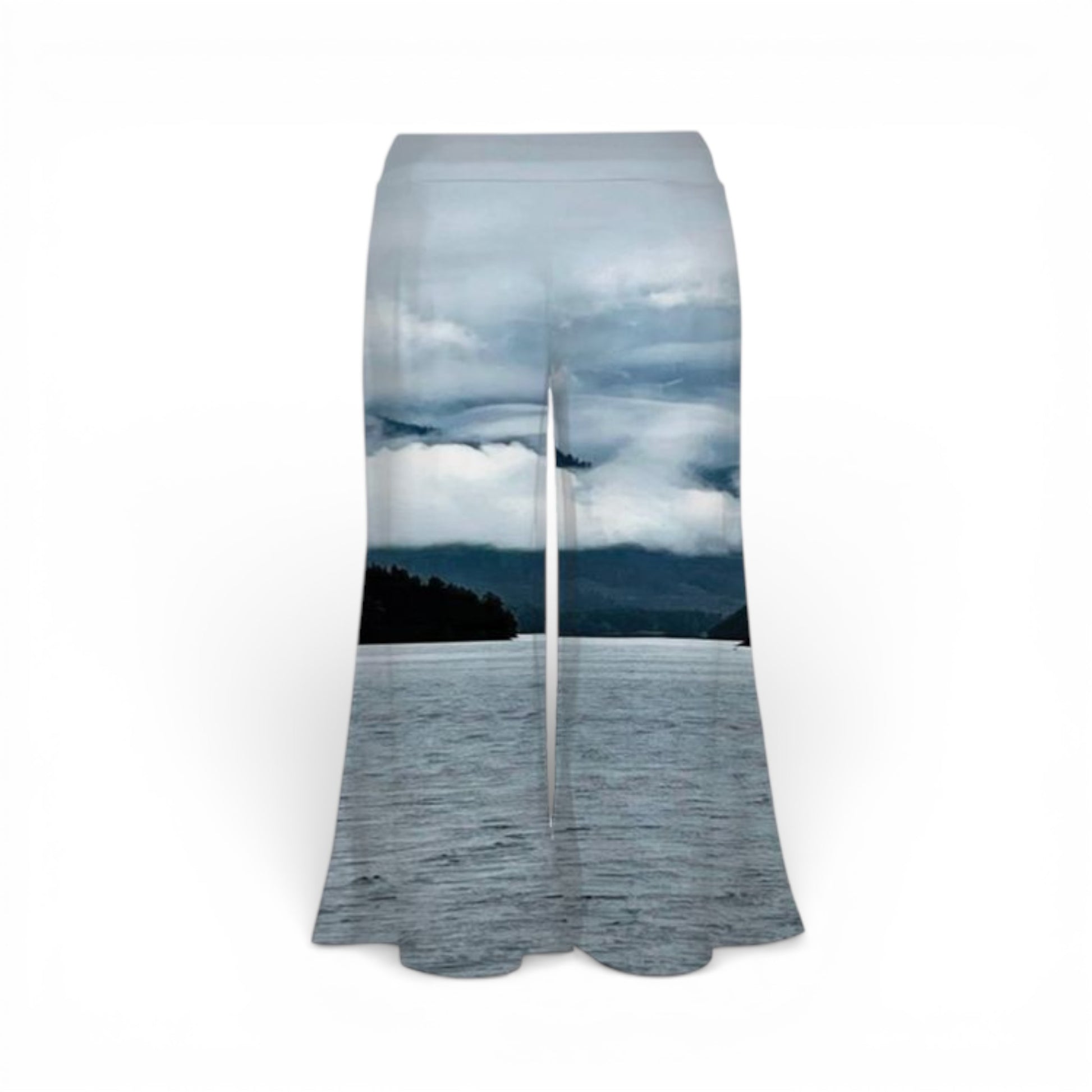 Pants with a scenic print of a lake and mountains on a white background