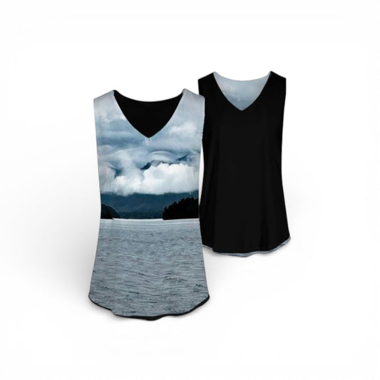 Two tank tops, one with a scenic print of a lake and mountains, the other black.