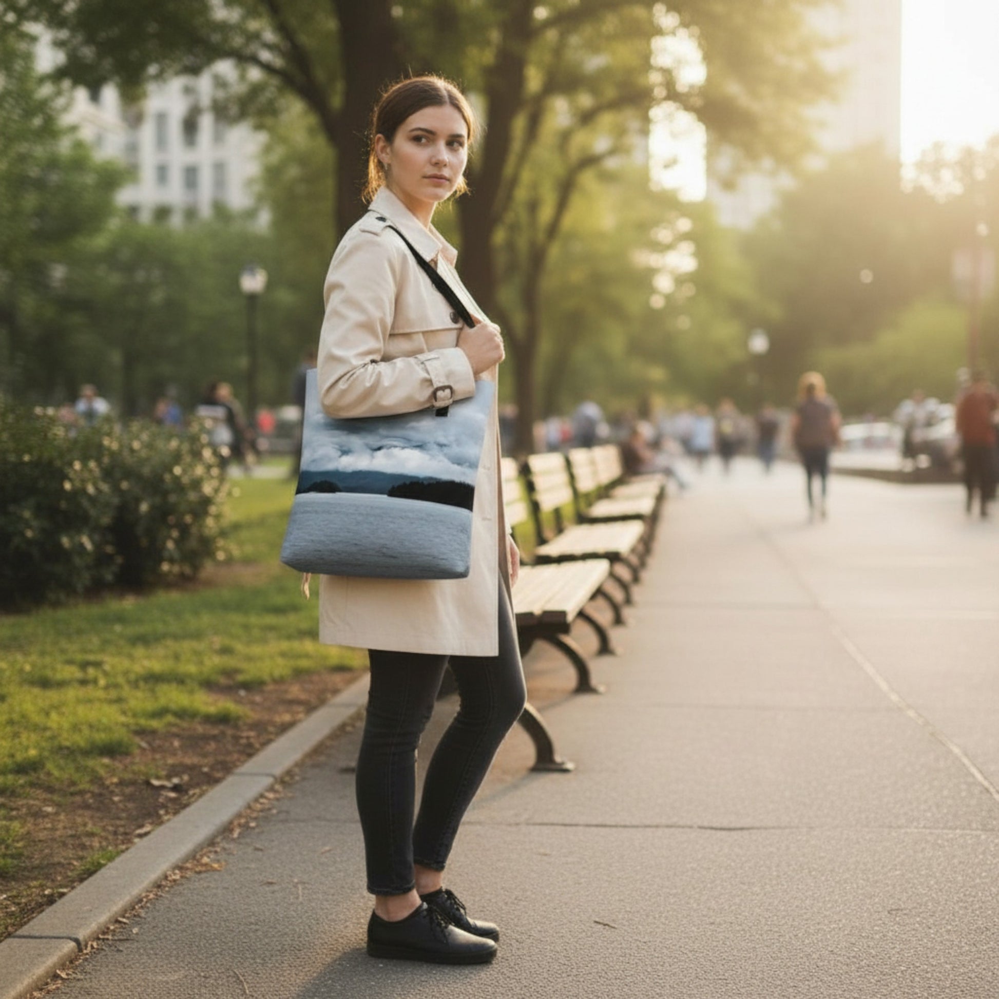 Woman holding a blue bag in a park setting
