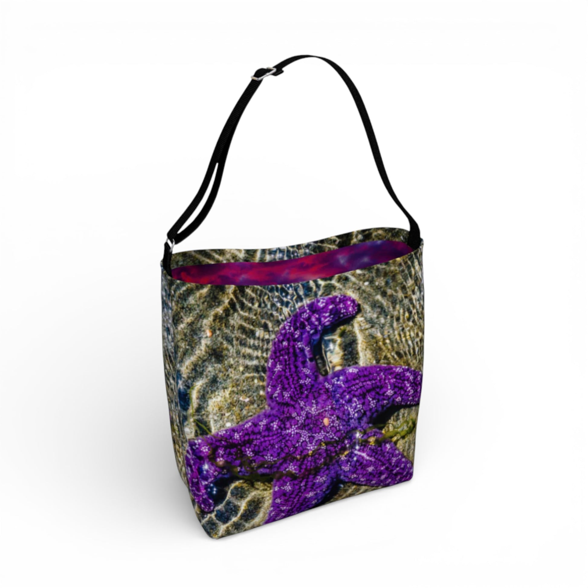 Tote bag with purple starfish design on a white background