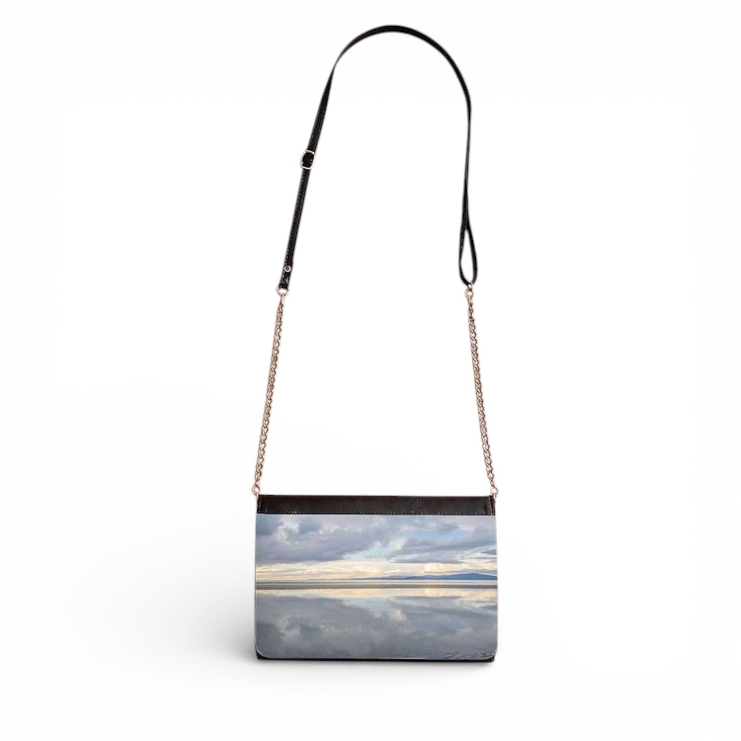Handbag with a scenic design of a beach and sky on a white background