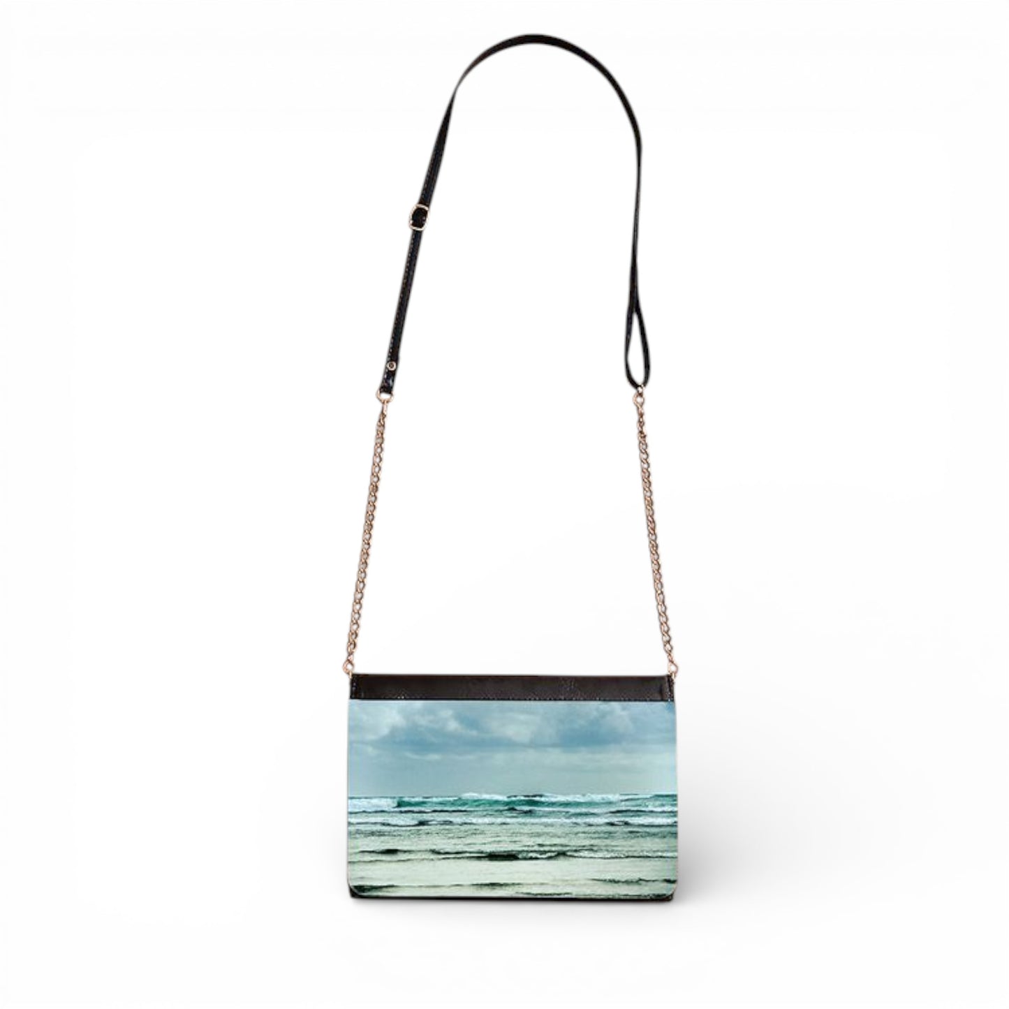 Handbag with a beach scene print on a white background