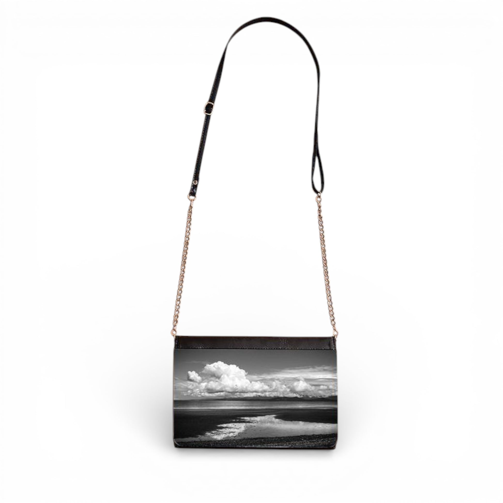 Handbag with a black and white landscape design on a white background