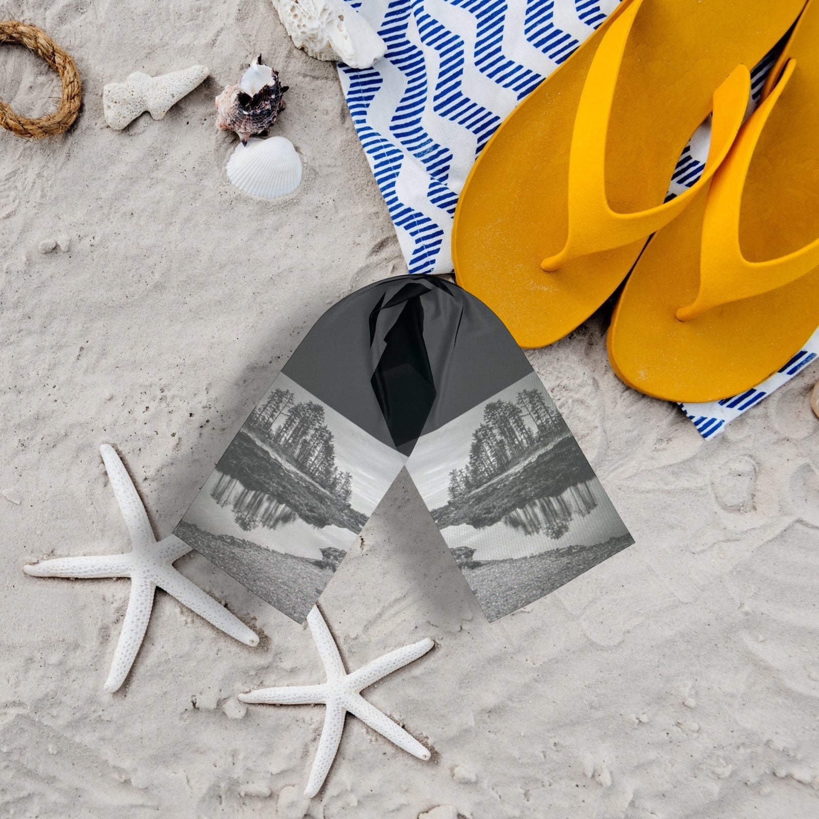 Wear your Big Beach Long Scarf to the beach! Picture shows scarf on the beach with sandals and starfish.