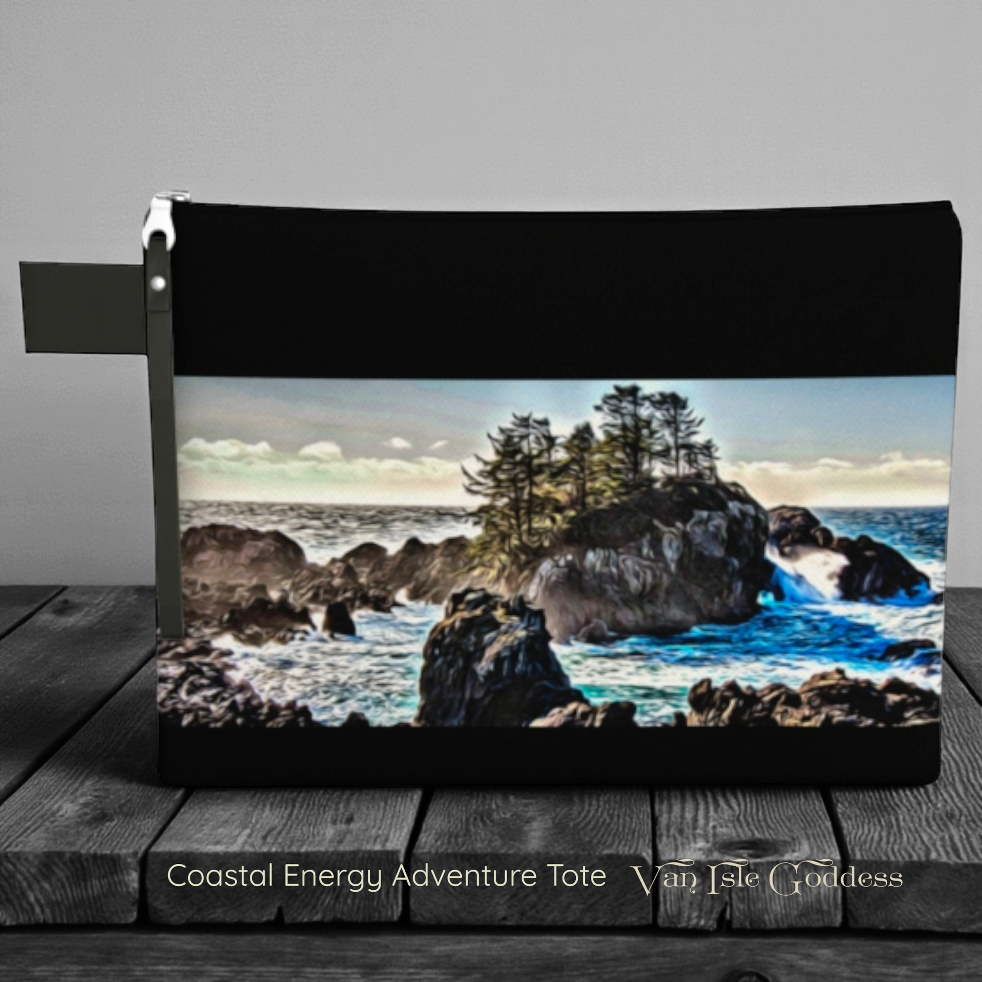 Tote bag with a scenic design of a coastal landscape on a wooden surface.