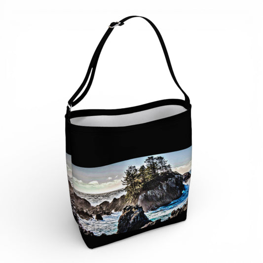 Tote bag with a scenic design of a beach and trees on a white background