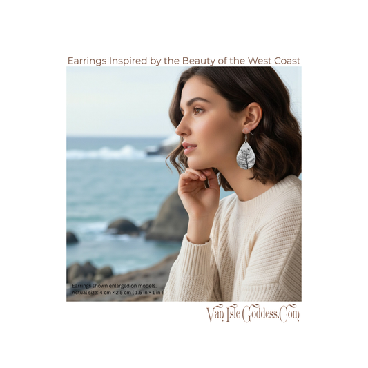 Woman wearing earrings with a scenic background of ocean and rocks, Van Isle Goddess brand visible.