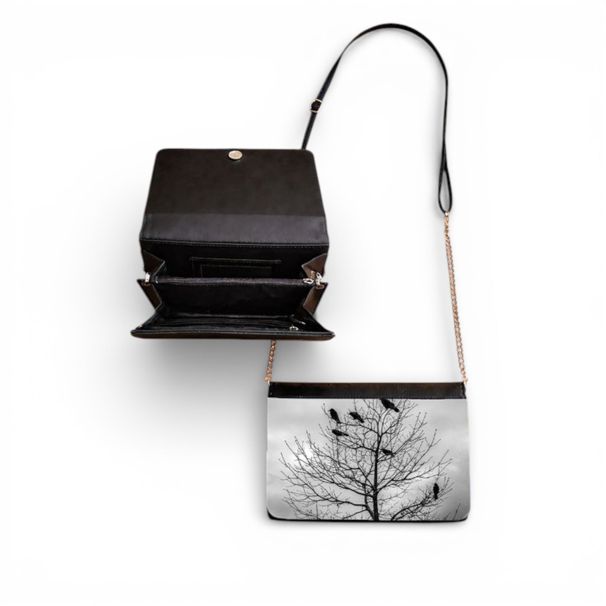 Black handbag with a tree and bird design on a white background