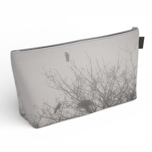 Pouch with bird silhouette design on a white background