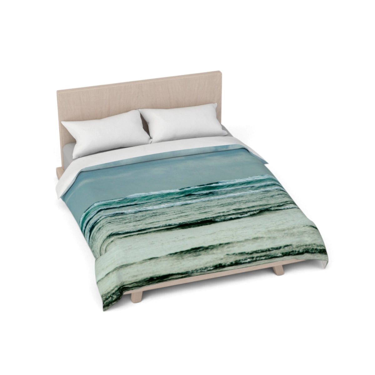A bed with a light wood frame and two white pillows, styled with a duvet cover featuring an abstract ocean wave pattern in shades of teal, blue, and green.