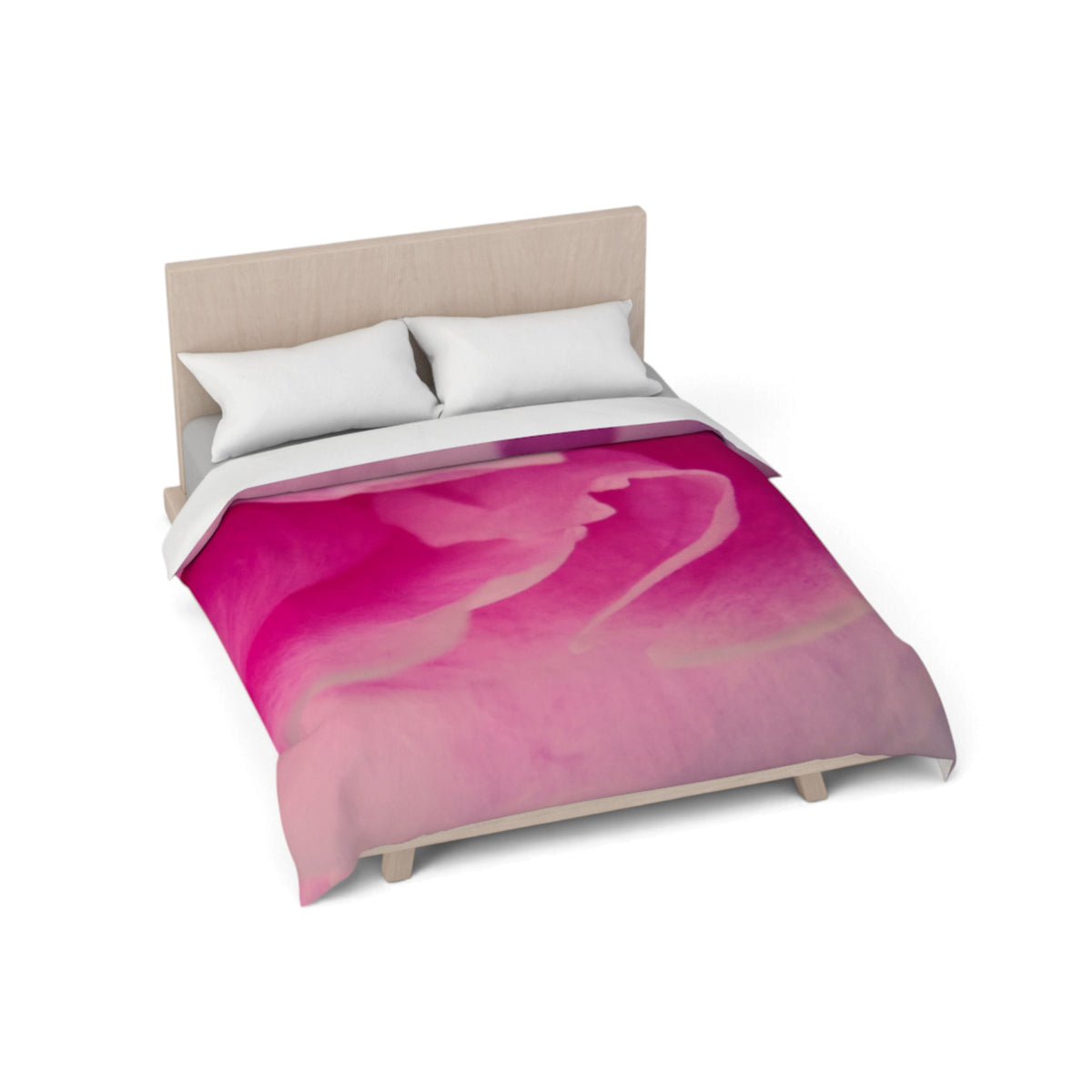 A bed with a vibrant pink and magenta abstract watercolor print duvet cover, styled with two white pillows and a light wood headboard, shown on a plain white background.