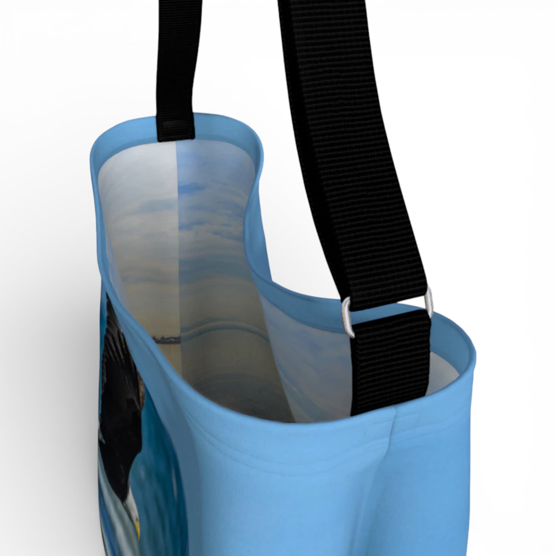 Blue bag with a black strap on a white background