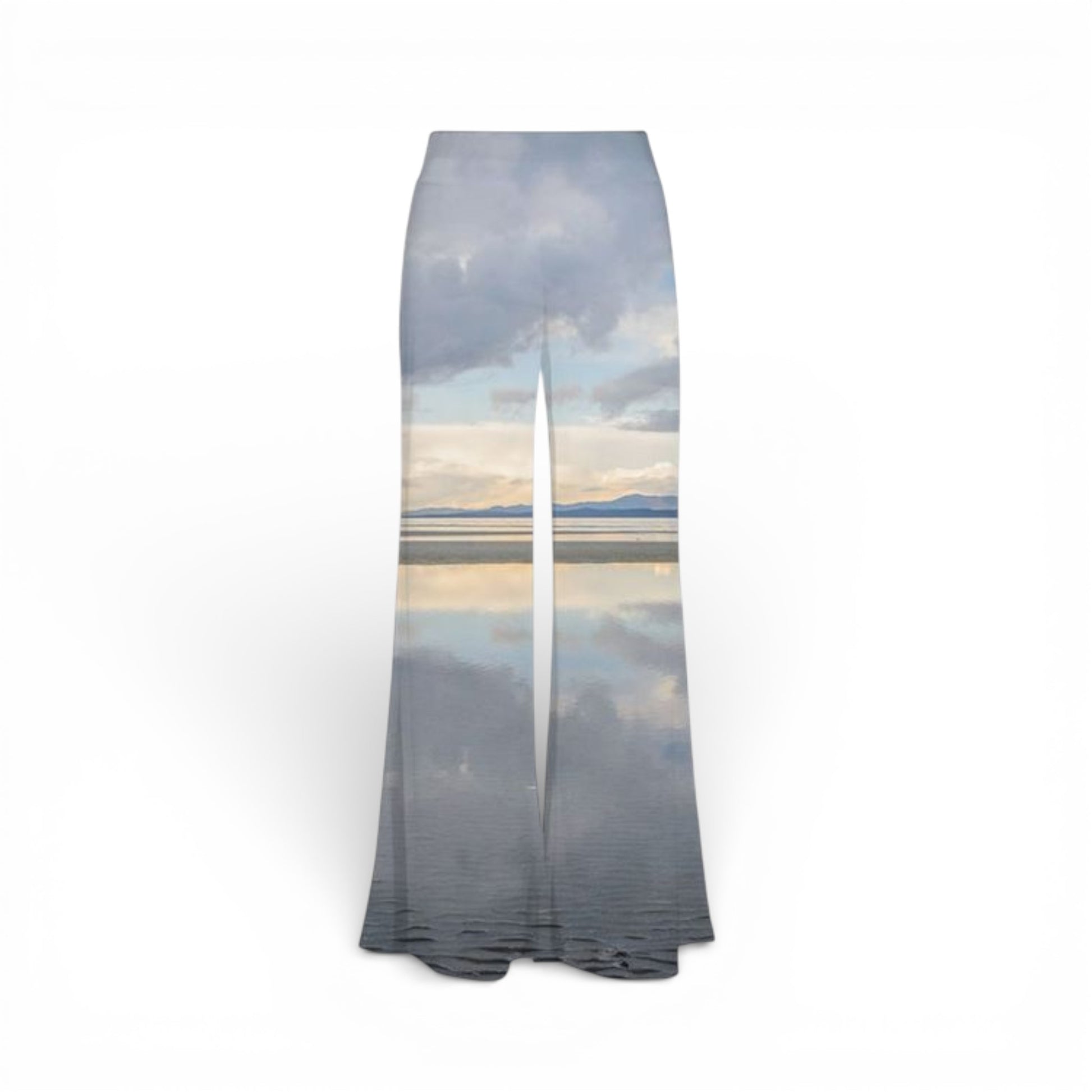 Palazzo pants with a scenic print of a mountain and sky on a white background
