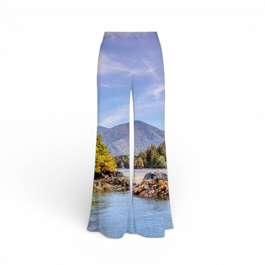 Pants with a scenic print of a lake and mountains on a white background