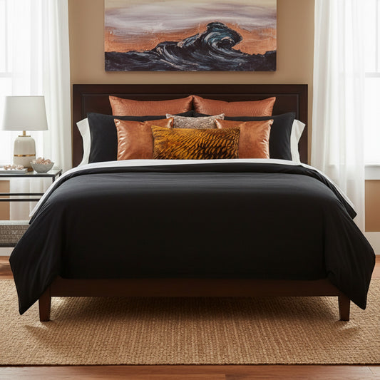 Neatly made bed with a variety of pillows.