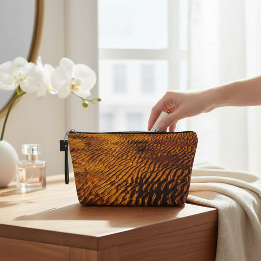 Handbag with sand stripe pattern on a wooden surface with a blurred background