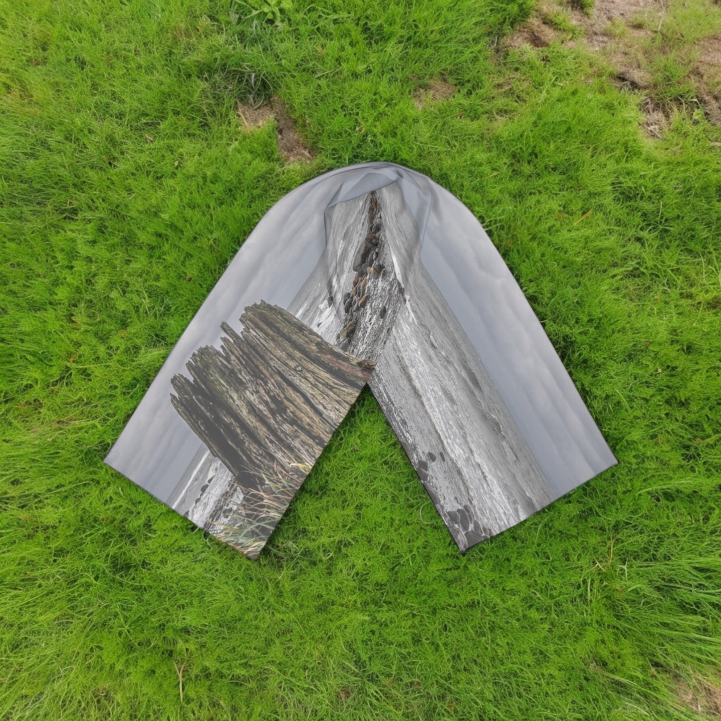 Gray Day Long Scarf on a bed of grass.