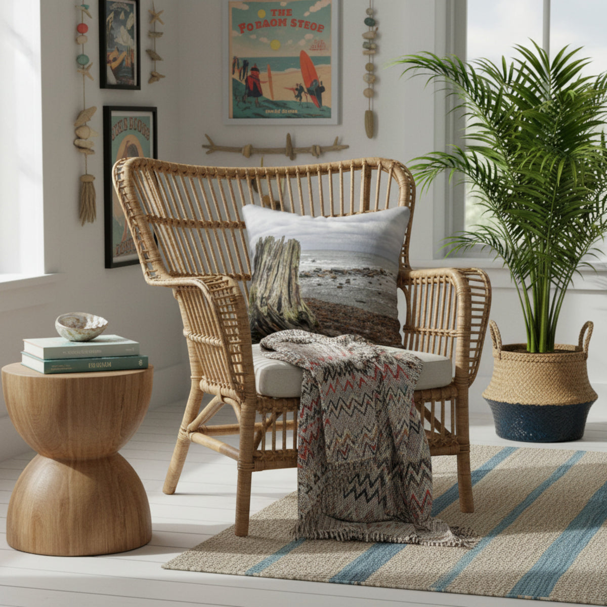 Beach themed pillow on a rattan chair in a ocean decorated room.