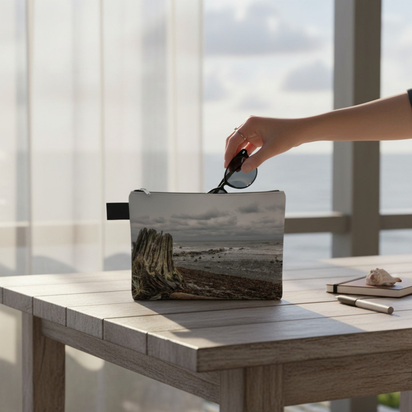 Person placing sunglasses in the Gray Day Qualicum Beach Adventure Tote by vanislegoddess.com