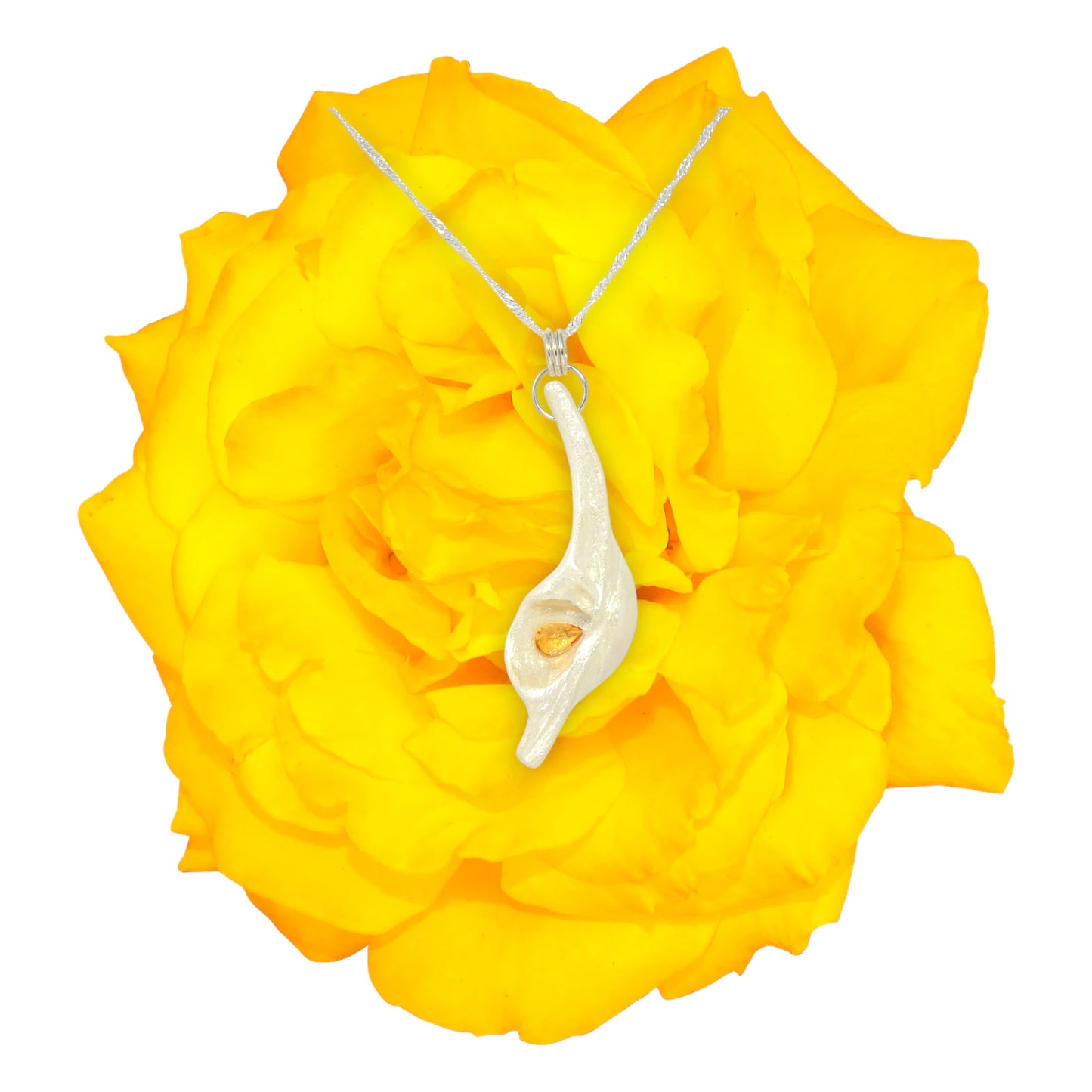 Sun Star natural seashell pendant with a beautiful pear shaped rose cut Citrine. The pendant is on top of beautiful yellow flower.