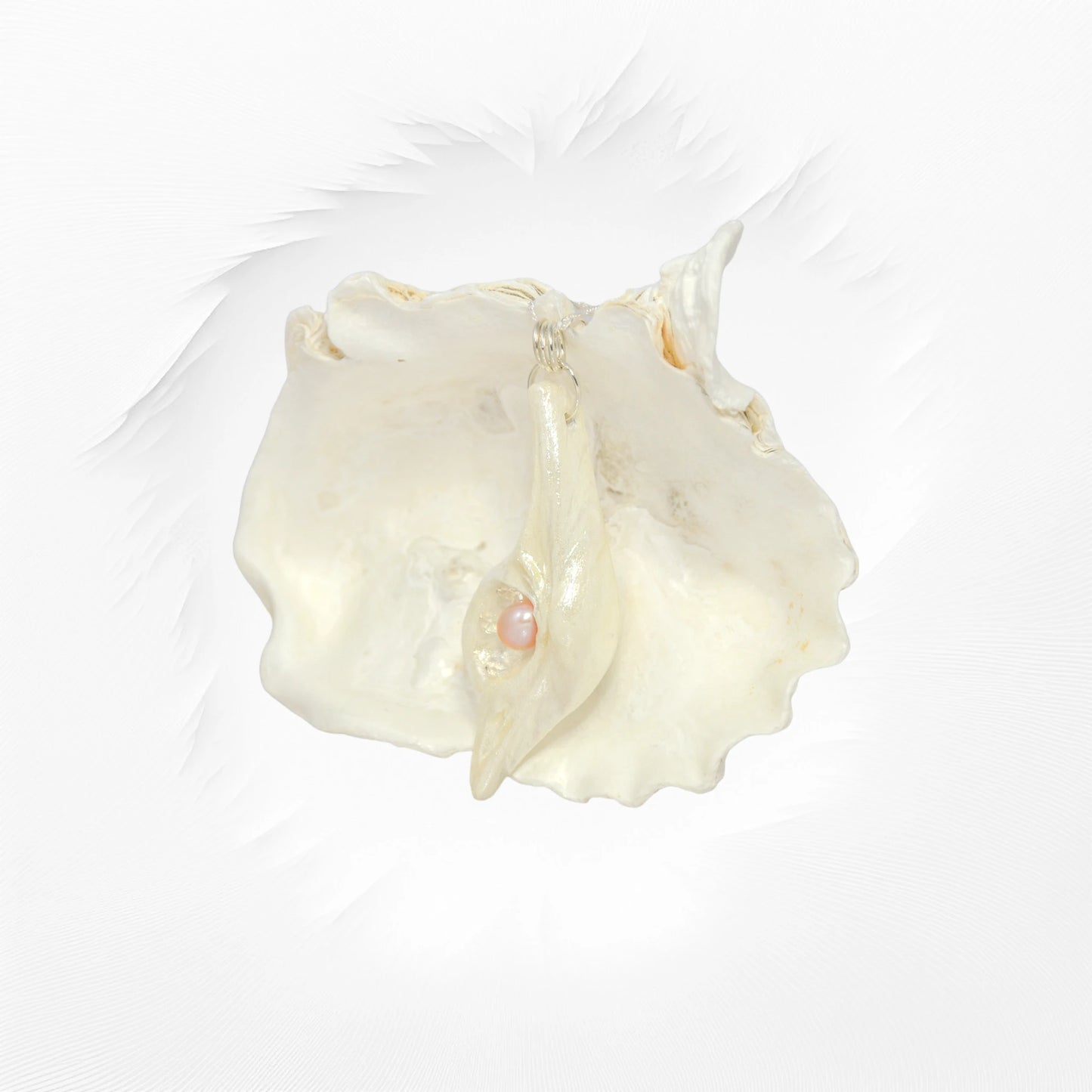 The pendant champagne on ice is shown hanging from a larger shell with white background.