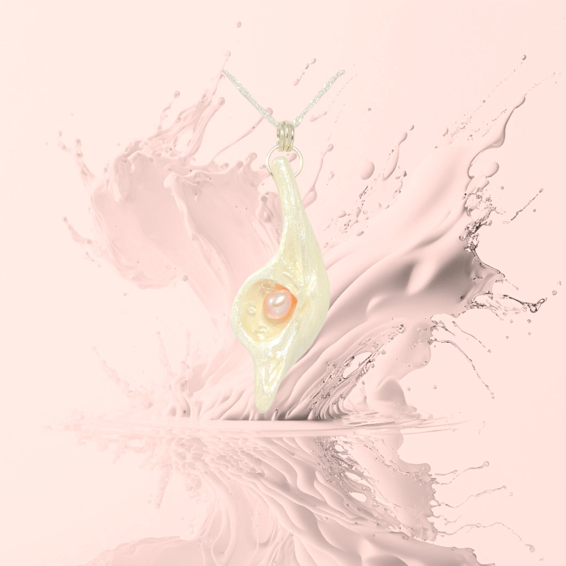 Champagne on Ice is the name of the one of kind pendant by Van Isle Goddess dot com.  The pendant is shown with a soft pink background.