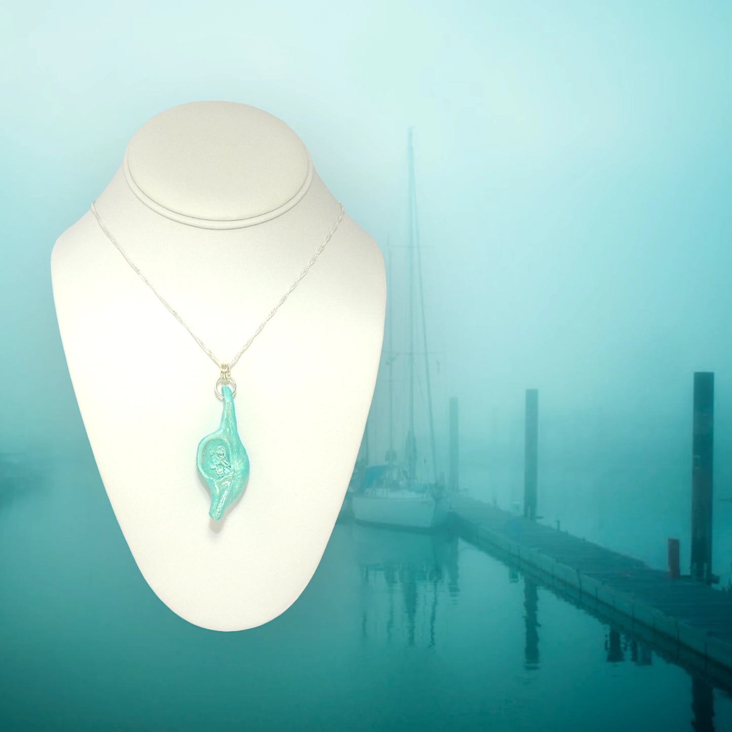 Diamond Mine Pendant is named for the eight herkimer diamonds that enhance the beauty of this gorgeous pendant!  The background shows a foggy marina.