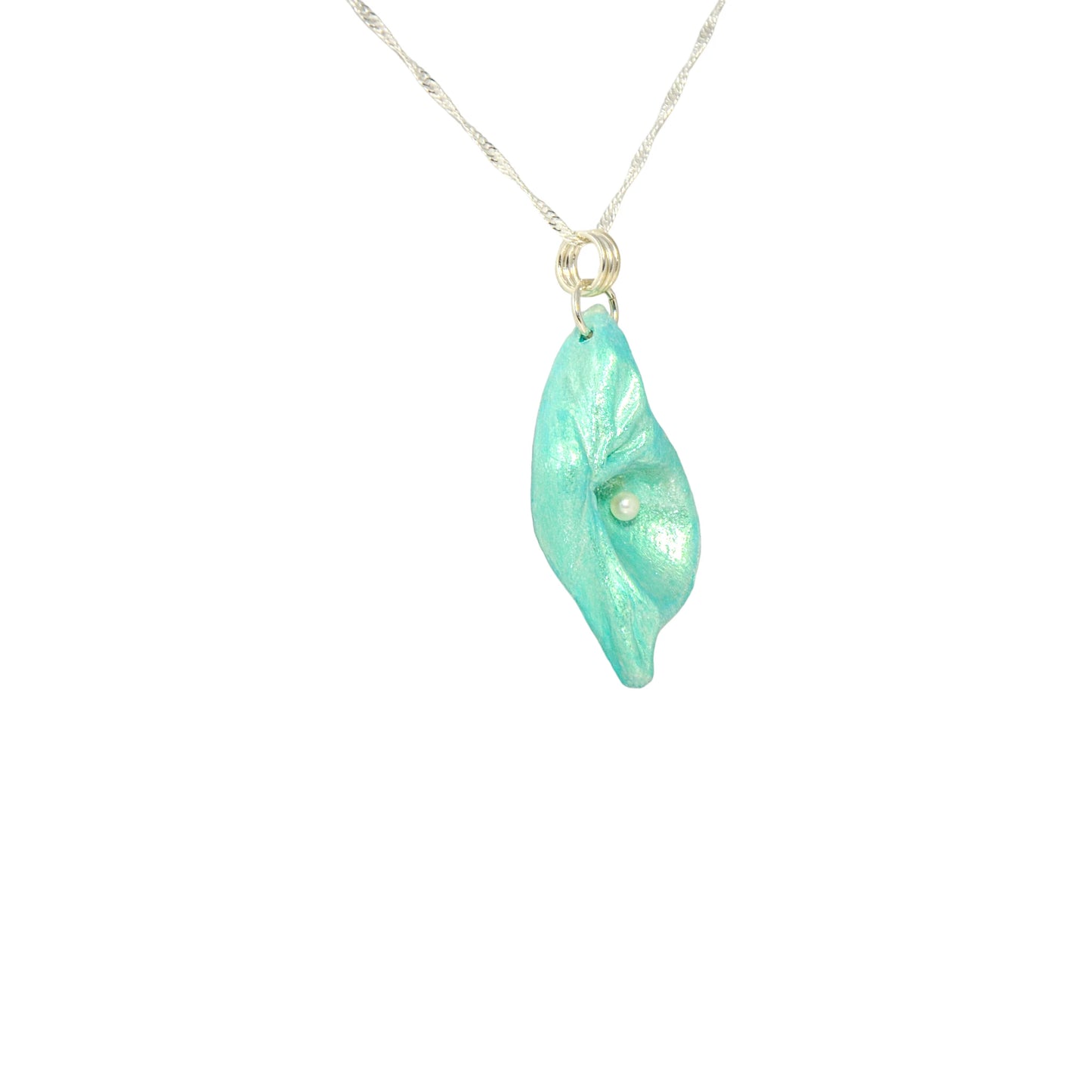 Ocean Pearl natural seashell pendant has a  real freshwater baby pearl.  The pendant is turned so the viewer can see the right side of the pendant.