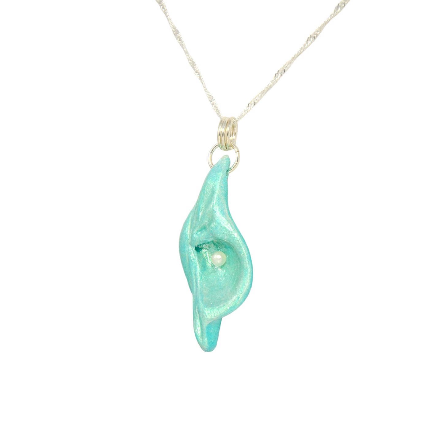 Ocean Pearl natural seashell pendant has a  real freshwater baby pearl. The pendant is turned so the viewer can see the left side of the pendant.