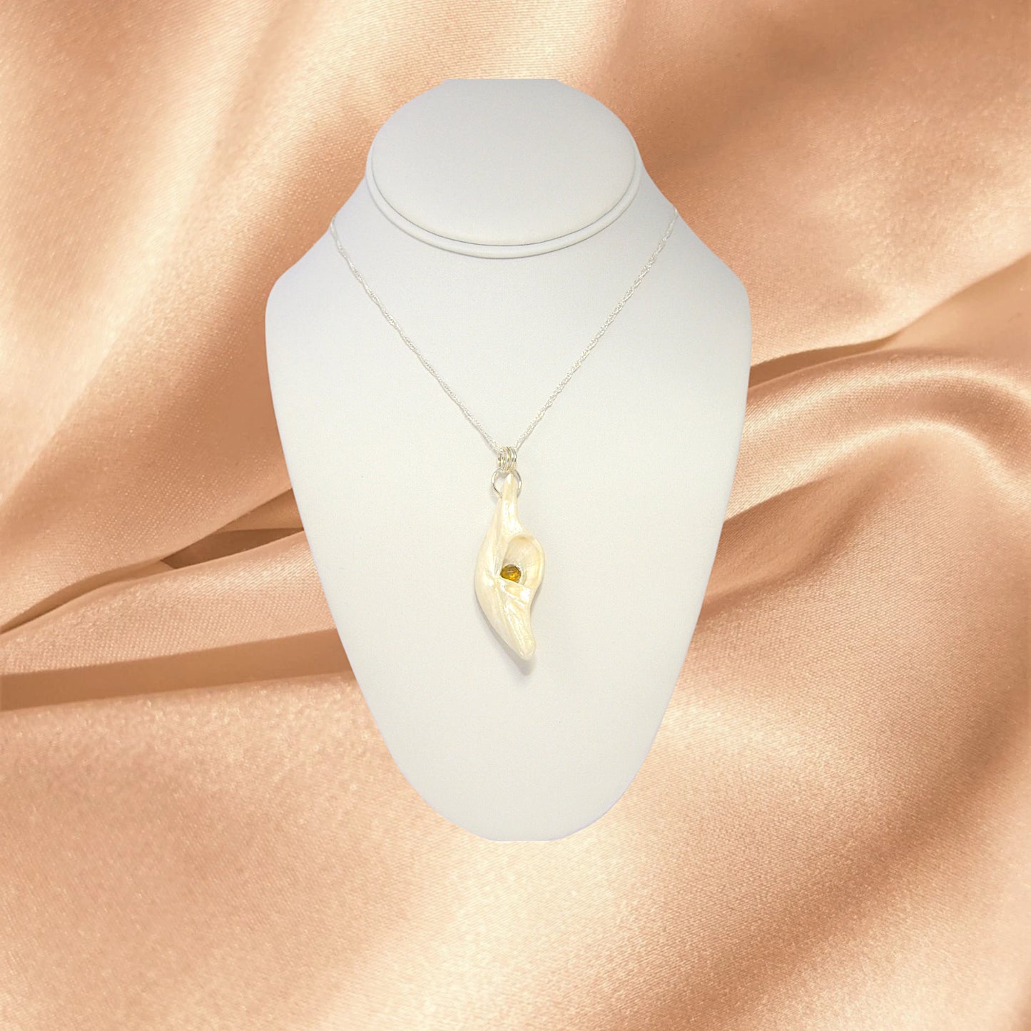 Seer is a natural seashell pendant with a beautiful 5mm rose cut Smokey Quartz compliments the pendant.