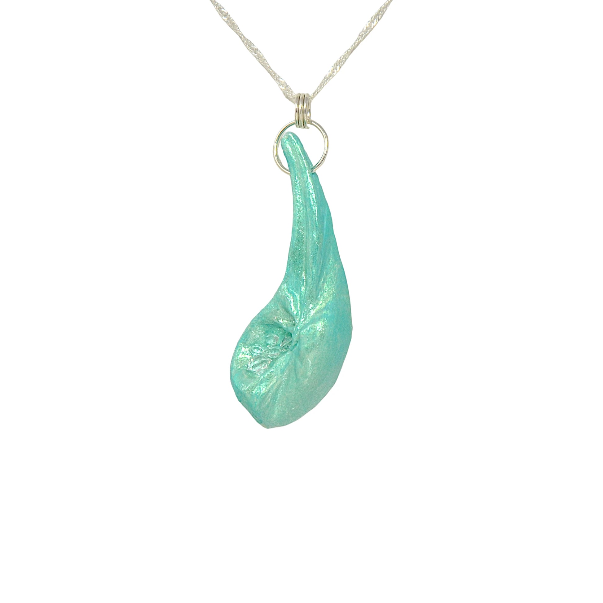 The Cascadia Pendant created with a natural seashell from the beaches of Vancouver Island.  The seashell is turquoise and has high quality herkimer diamonds.