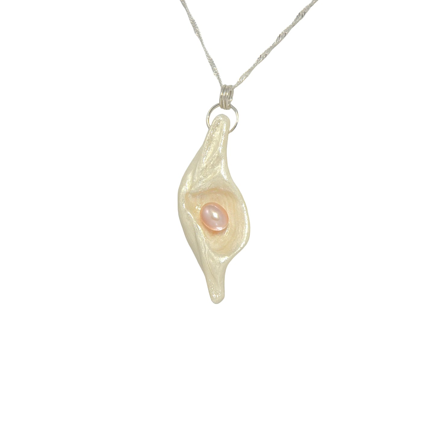 Glow natural seashell pendant with a pink freshwater pearl. 