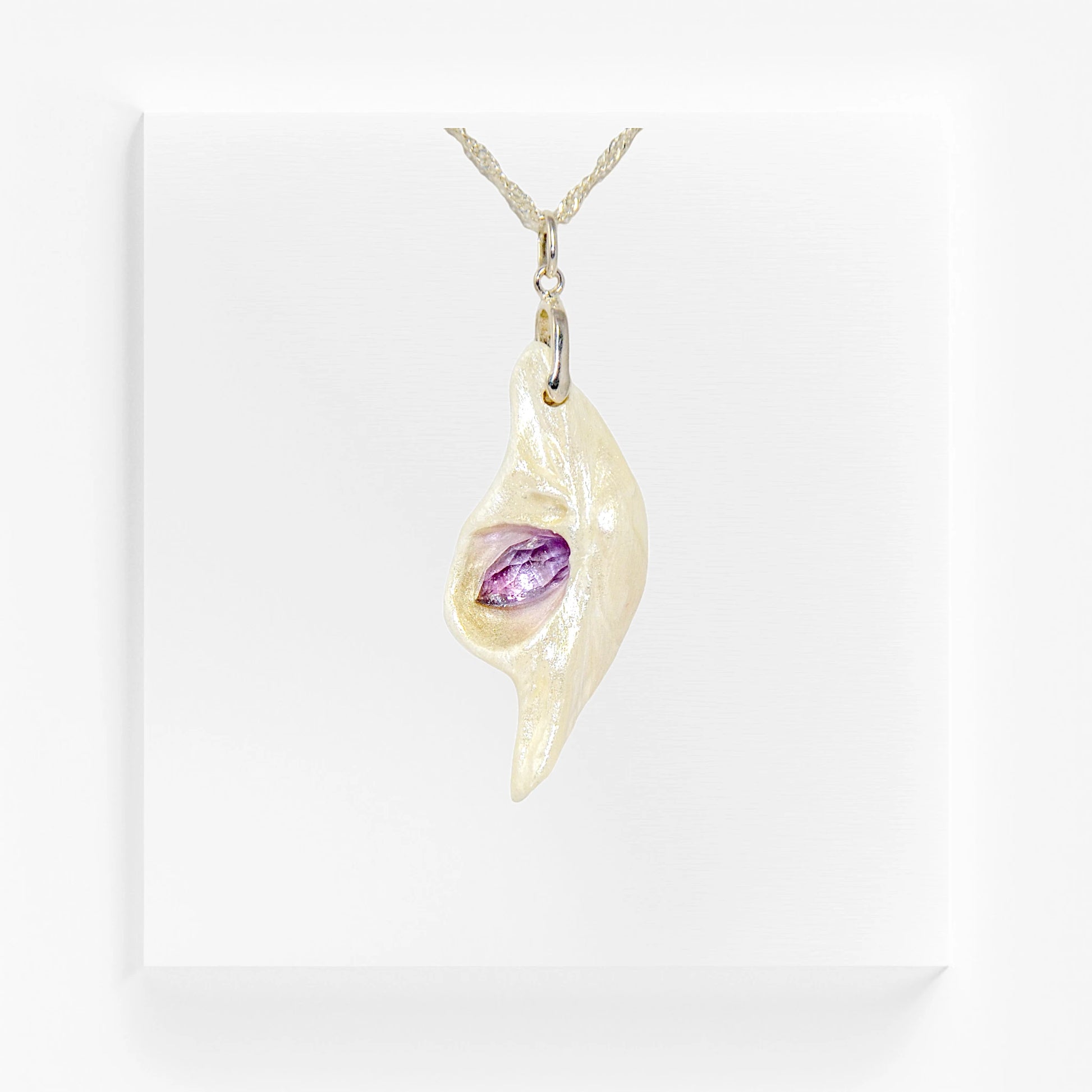 Intuition a natural seashell pendant with a beautiful rose cut marquise Amethyst. 
