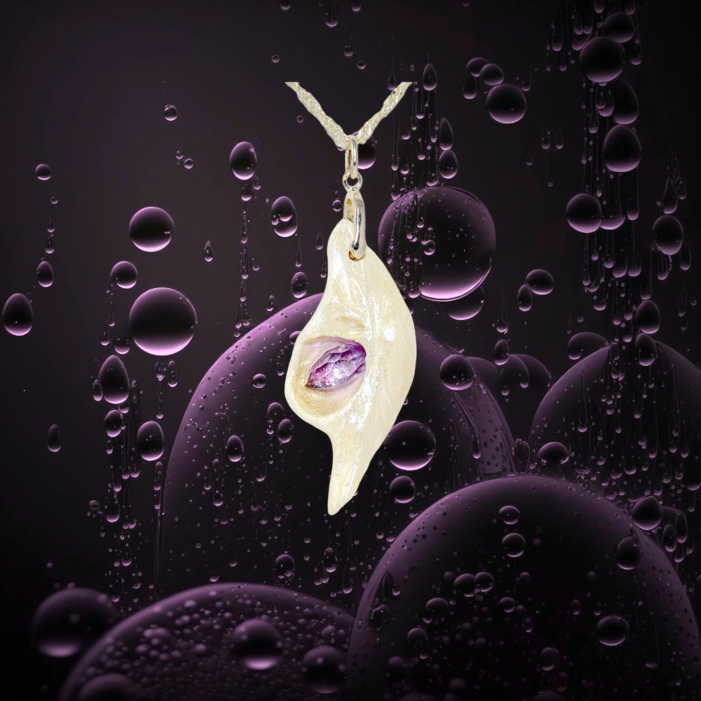 Intuition a natural seashell pendant with a beautiful rose cut marquise Amethyst.  The background is water bubbles. 