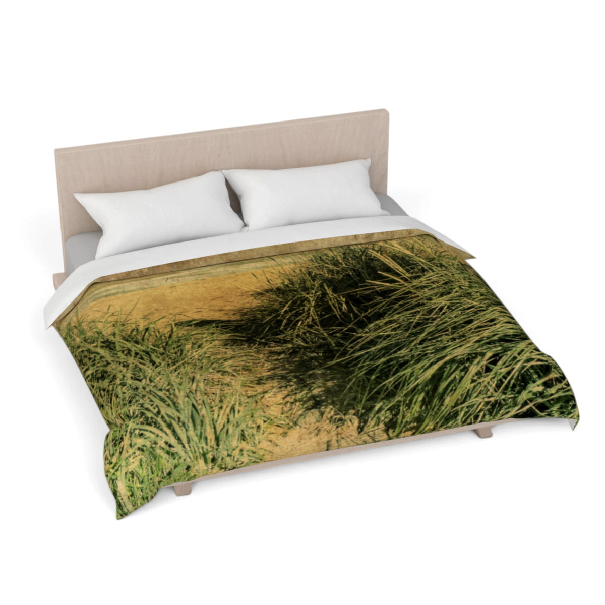 A bed dressed with a duvet cover featuring a printed grassy landscape scene, styled with two white pillows and a light wood headboard on a white background.