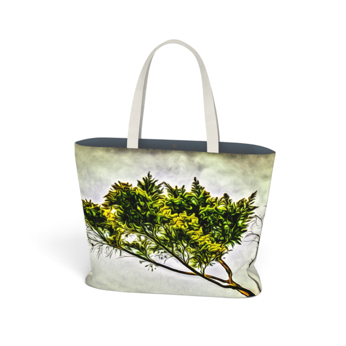 A tote bag with a printed design of a green tree branch against a cloudy sky, featuring off-white fabric handles and a dark navy blue interior lining, shown on a plain white background.