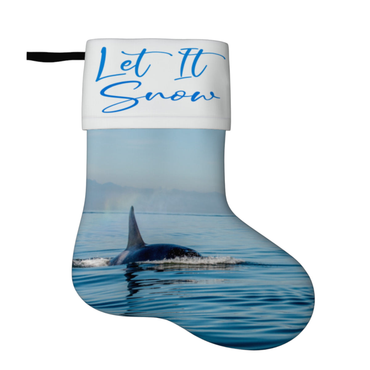 A Christmas stocking with a white cuff featuring the blue script text 'Let It Snow' and a printed image of an orca whale surfacing in blue water below.