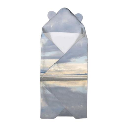 Baby swaddle with bear ears featuring a scenic design on a white background