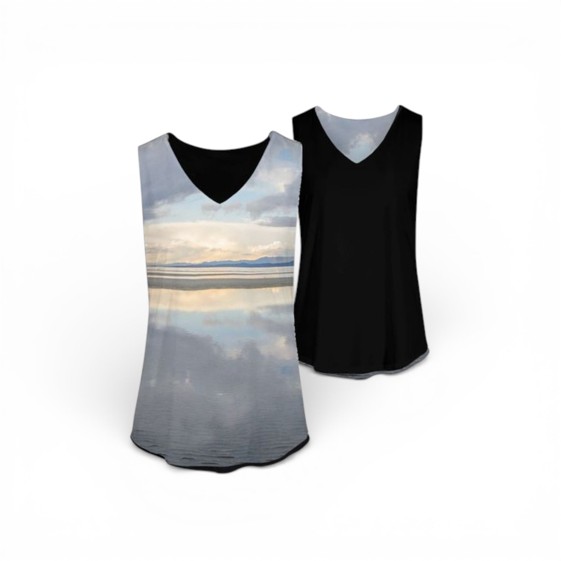 Two tank tops, one with a scenic design and one black, on a white background