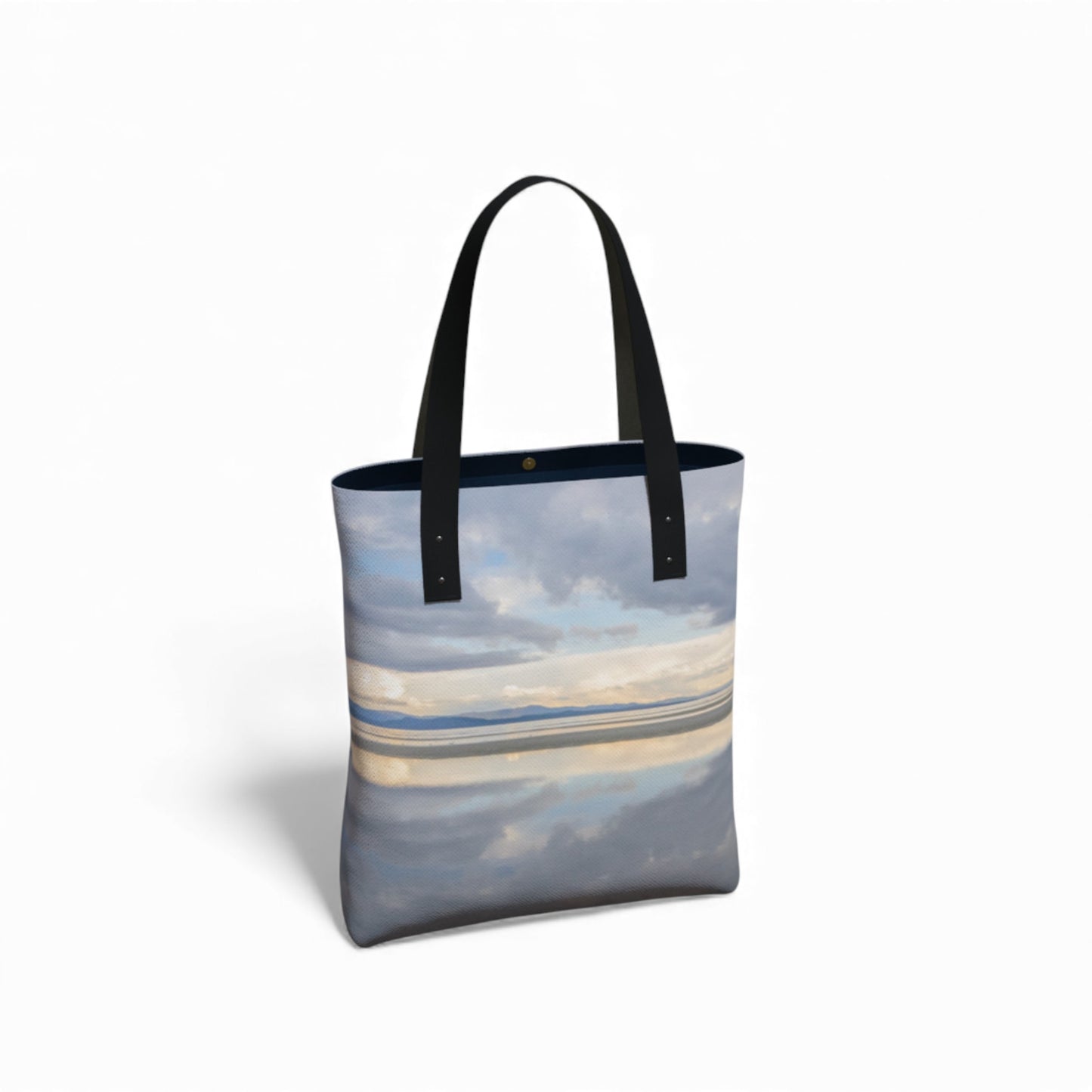 Tote bag with a beach scene design on a white background