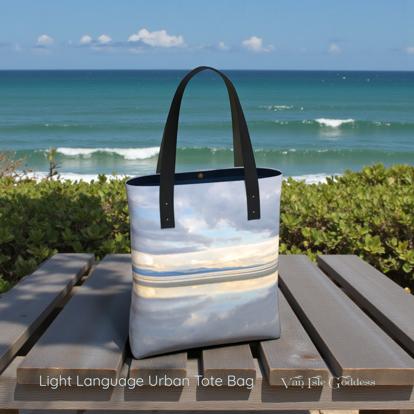 Light Language Urban Tote Bag on a wooden table with ocean and sky background