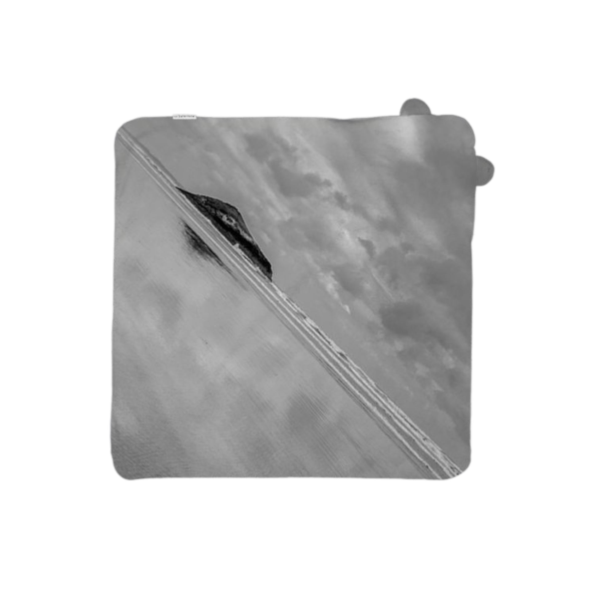 black and white image of the beach on a baby towel