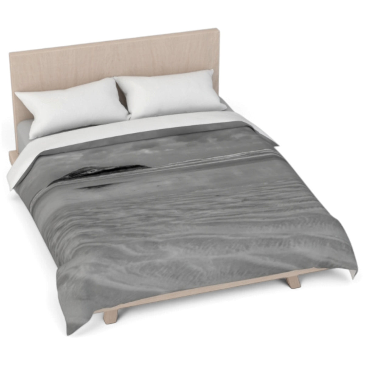 A bed dressed in a gray and black abstract patterned comforter with two white pillows, set against a light wood headboard and frame on a white background.