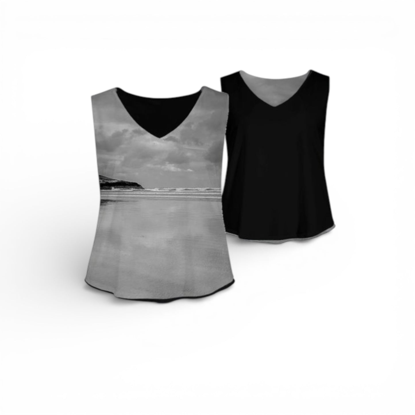 Two tank tops, one with a landscape print and the other black, on a white background.