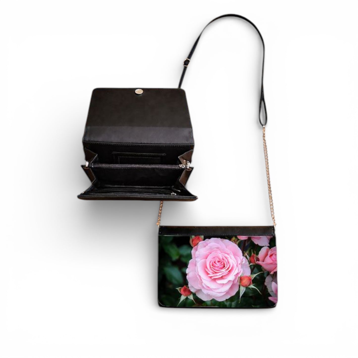 Black handbag with floral design on a white background