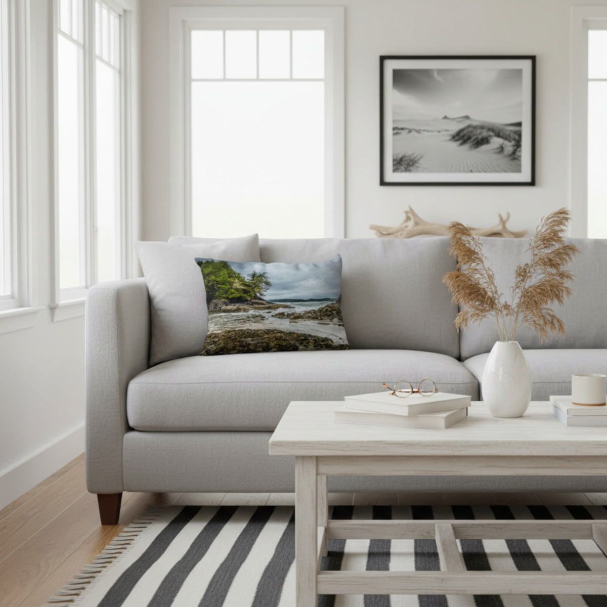 A throw pillow cover featuring an image of a coastal scene with rocks and trees on a beach.