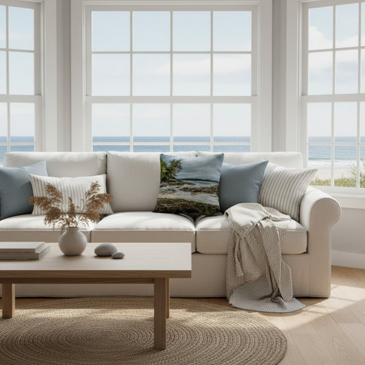 A throw pillow cover featuring an image of a coastal scene with rocks and trees on a beach.